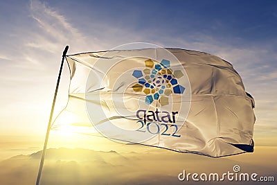 2022 FIFA World Cup Qatar flag textile cloth fabric waving on the top sunrise mist fog Editorial Stock Photo