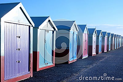 Fifteen beach huts on Brighton promenade Stock Photo