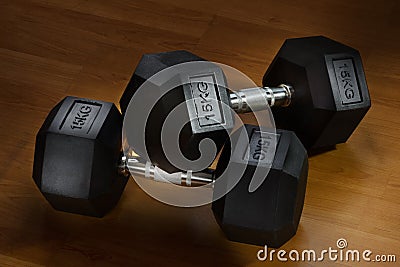 Fifteen Kilograms hexagon dumbells on the floor Stock Photo