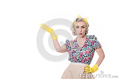 Fifties housewife indicating'special offer', humorous concept, Stock Photo