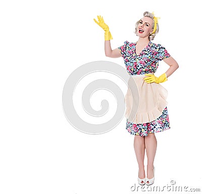 Fifties housewife indicating'special offer', humorous concept, Stock Photo