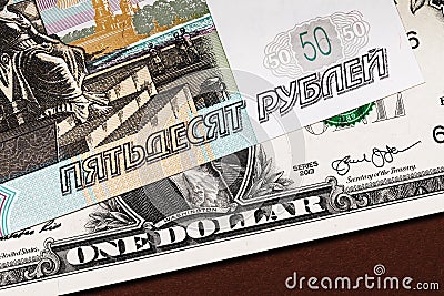 Fifty Russian rubles on a dollar bill Stock Photo