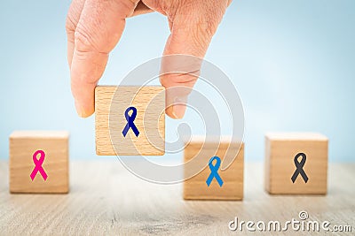 Fight cancer, Colorful ribbons on wooden cubes background, Symbol of fight against disease, cure cancer, cancer awareness day, Stock Photo