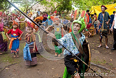 Fighter and dancers at Pasola Festival, Kodi, Sumba Island, Nusa Tenggara Editorial Stock Photo