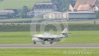 A fighter jet sitting on top of a runway Editorial Stock Photo