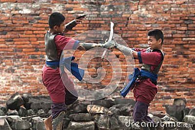 Fighters take part in an outdoor ancient Thai fencing. Editorial Stock Photo