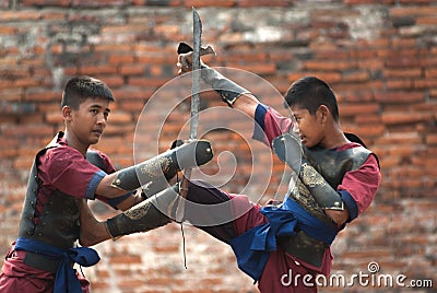 Fighters take part in an outdoor ancient Thai fencing. Editorial Stock Photo