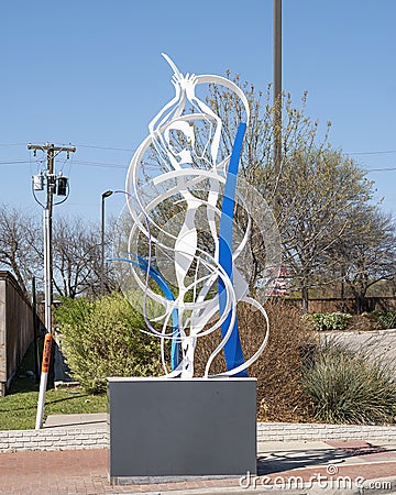 Figurative steel sculpture by Joshua Weiner on 15th Street in Plano, Texas. Editorial Stock Photo