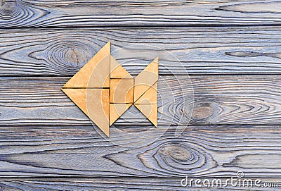 Figure of fish from wooden puzzles Stock Photo