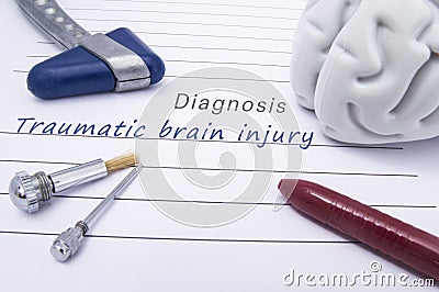 Figure of human brain, blue neurological reflex hammer, neurological needle and brush for test sensitivity and ballpoint pen lie o Stock Photo