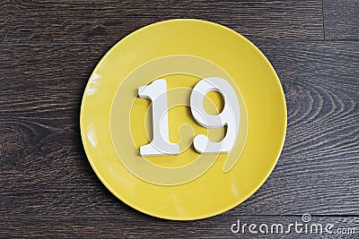 Figure nineteen on the yellow plate. Stock Photo