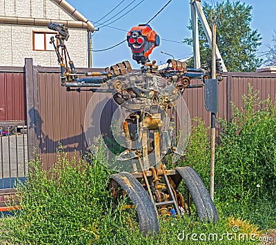 The figure of a robot assembled from old auto parts. Editorial Stock Photo