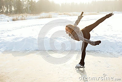 Figure skating woman at the frozen lake Stock Photo