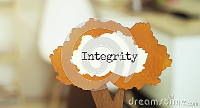 Figure of a tree with text INTEGRITY inside the foliage. Business concept Stock Photo