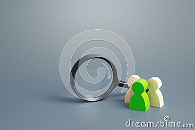 Figures of people stand near a magnifying glass. Search for jobs and vacancies. Human resources. Contractors and performers. Stock Photo