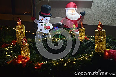 Figures snow white and santa claus and the fourth advent candle in the bistarac Stock Photo