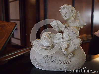 Figurine of angels with the inscription Welcome Stock Photo