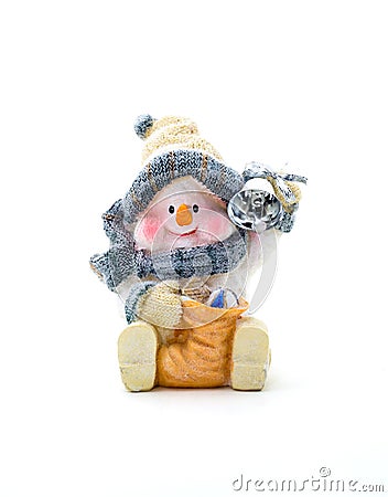 Figurine cheerful snowman holding a bell. Stock Photo