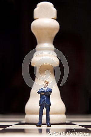 Figurine and chess Stock Photo