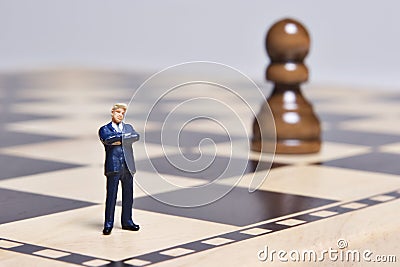 Figurine and chess Stock Photo