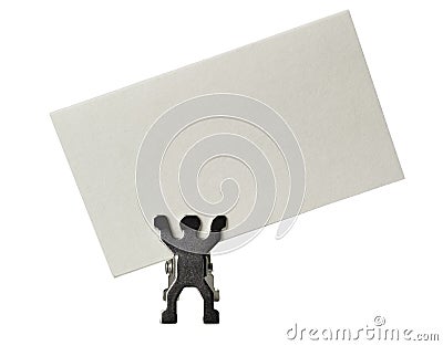 Figurine holding a piece of blank business card Stock Photo