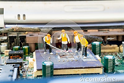 Figurine maintenance team model repair main board computer Stock Photo