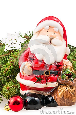 Figurine of Santa Claus near the branch of a Christmas tree Stock Photo