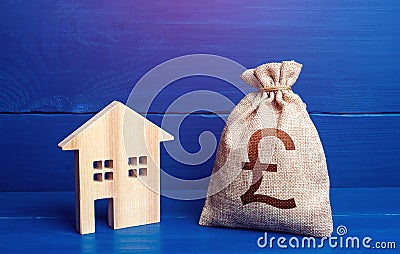 Figurine silhouette house and british pound sterling money bag. Maintenance, property improvement. Taxes. Mortgage loan. Proposal Stock Photo