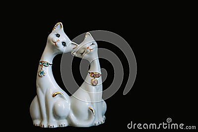 Figurine two black cat`s isolated on black Stock Photo