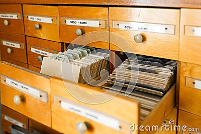 A file cabinet or cabinet with an open drawer and files. Database concept. File cabinet with library or office. Two Stock Photo