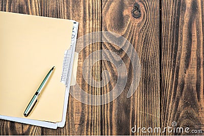 File Folder with pen on wooden background Stock Photo