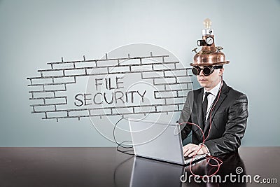 File security text with vintage businessman using laptop Stock Photo