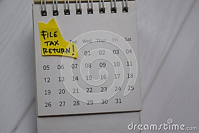 File Tax Return text on monthly Calendar isolated on office desk Stock Photo