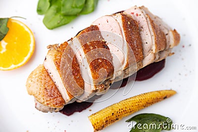 Files of the breast duck grill with beets, mini corn and spinach, fried sage, orange and lingonberry sauce. Stock Photo