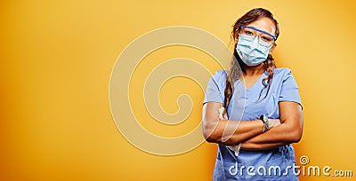 Filipina nurse wearing facemask and PPE Stock Photo
