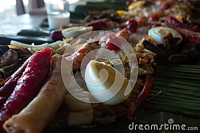 Filipino authentic traditional buffet: philippine finger food on banana leaf Stock Photo