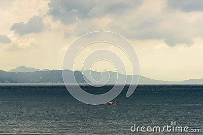 Filipino Banca boats being drenched by a midday rain Stock Photo