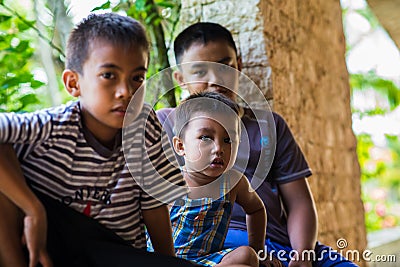 Filipino boys asia sitting watching aid effort earthquake Editorial Stock Photo