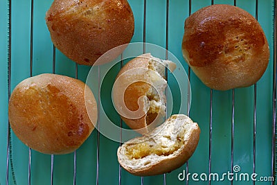 Filipino bread called Pan de Coco or bread roll filled with sweetened shredded coconut meat Stock Photo