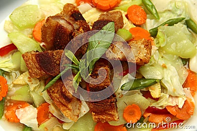 Filipino dish called Chopsuey topped with Lechon Kawali Stock Photo