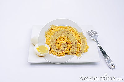 A Filipino Pancit Canton with boiled egg on a plate. Stock Photo