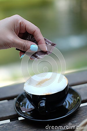Fill sugur to the coffee cup Stock Photo
