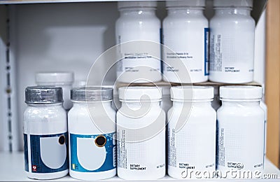 Fill up on essential nutrients through dietary supplements. shelves stocked with various medicinal products in a Stock Photo