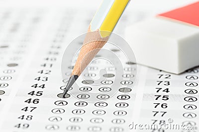 Filled answer sheet with eraser and pencil Stock Photo