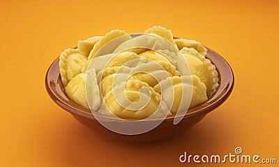 Filled dumplings, homemade russian vareniki, pelmeni in bowl Stock Photo