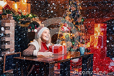 Filled with happiness cheer and love. Girl enjoy cozy warm atmosphere christmas eve. Christmas joy. Woman wooden Stock Photo