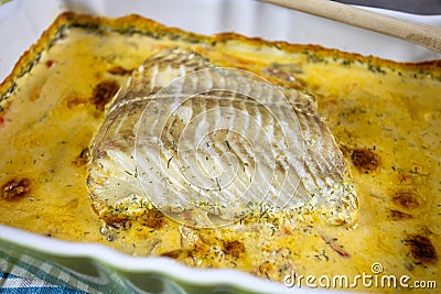 Fillet of coalfish cooked in the oven with sauce Stock Photo