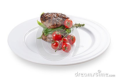 Fillet mignon with cherry tomatoes. Stock Photo