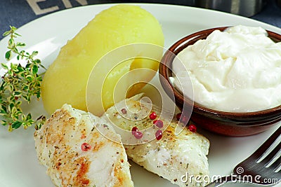 Fillet of sea bass and aÃ¯oli with potatoes Stock Photo