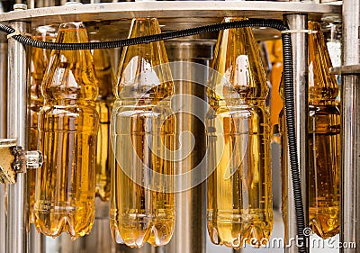 Filling bottles with juice Stock Photo